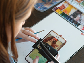 Alumna Molly Quinn uses TikTok videos to help propel her watercolor business to success.